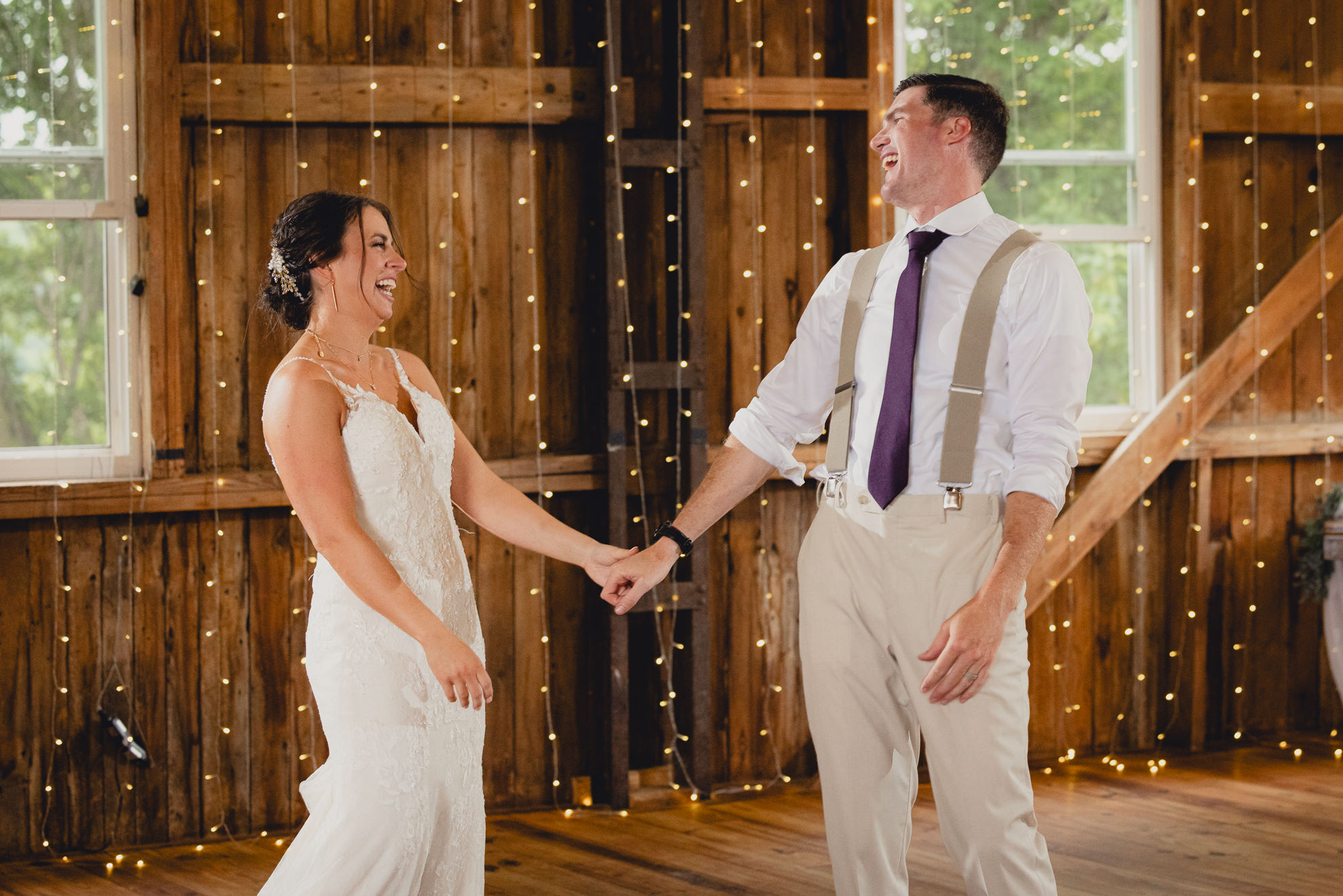 bride and groom dance during wedding reception at The Gallagher Barn in Medina, NY