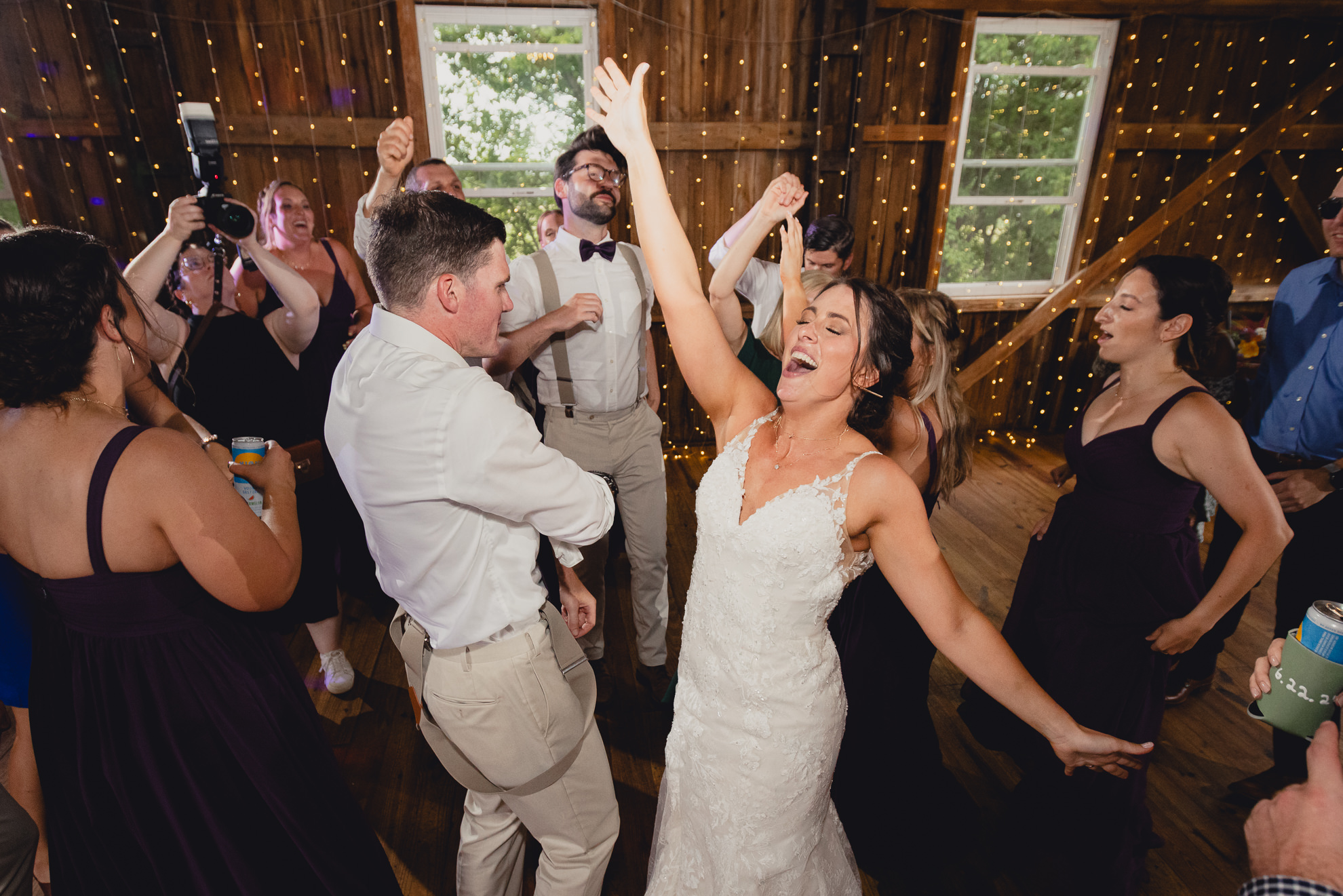 guests dance during wedding reception at The Gallagher Barn in Medina, NY