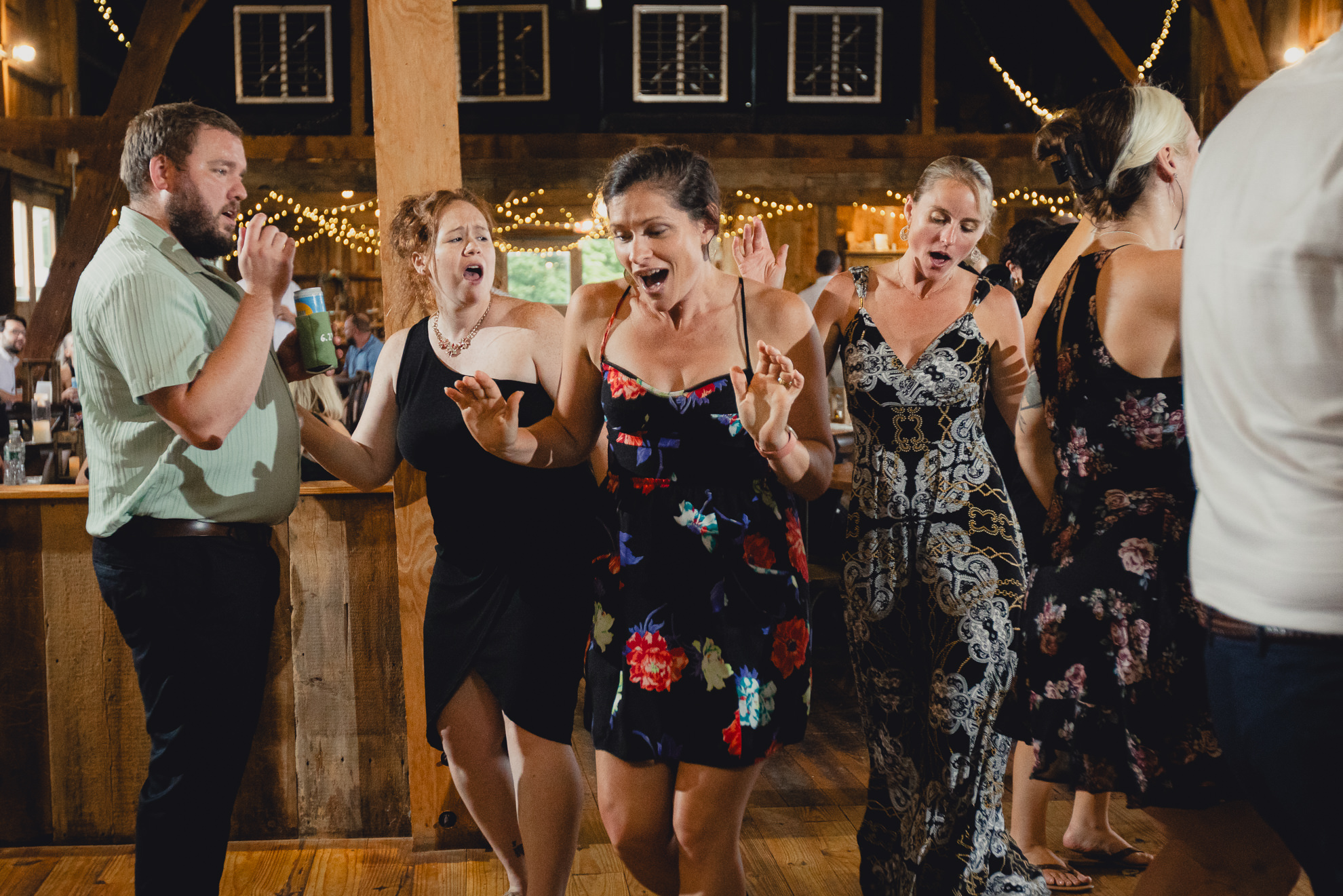 guests dance during wedding reception at The Gallagher Barn in Medina, NY
