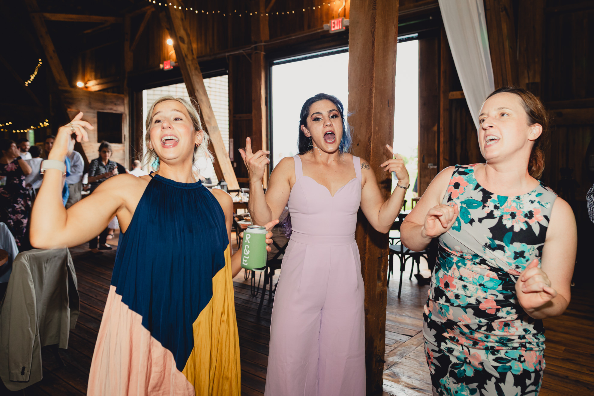 guests dance during wedding reception at The Gallagher Barn in Medina, NY