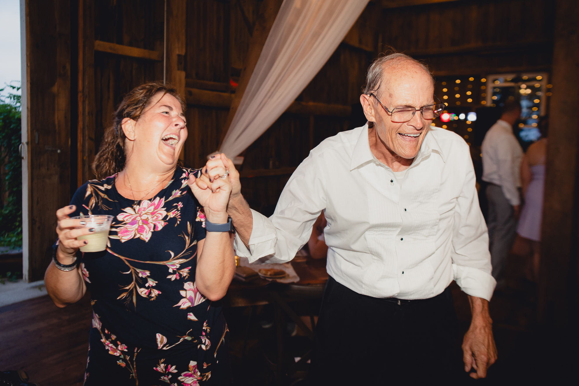 guests dance during wedding reception at The Gallagher Barn in Medina, NY