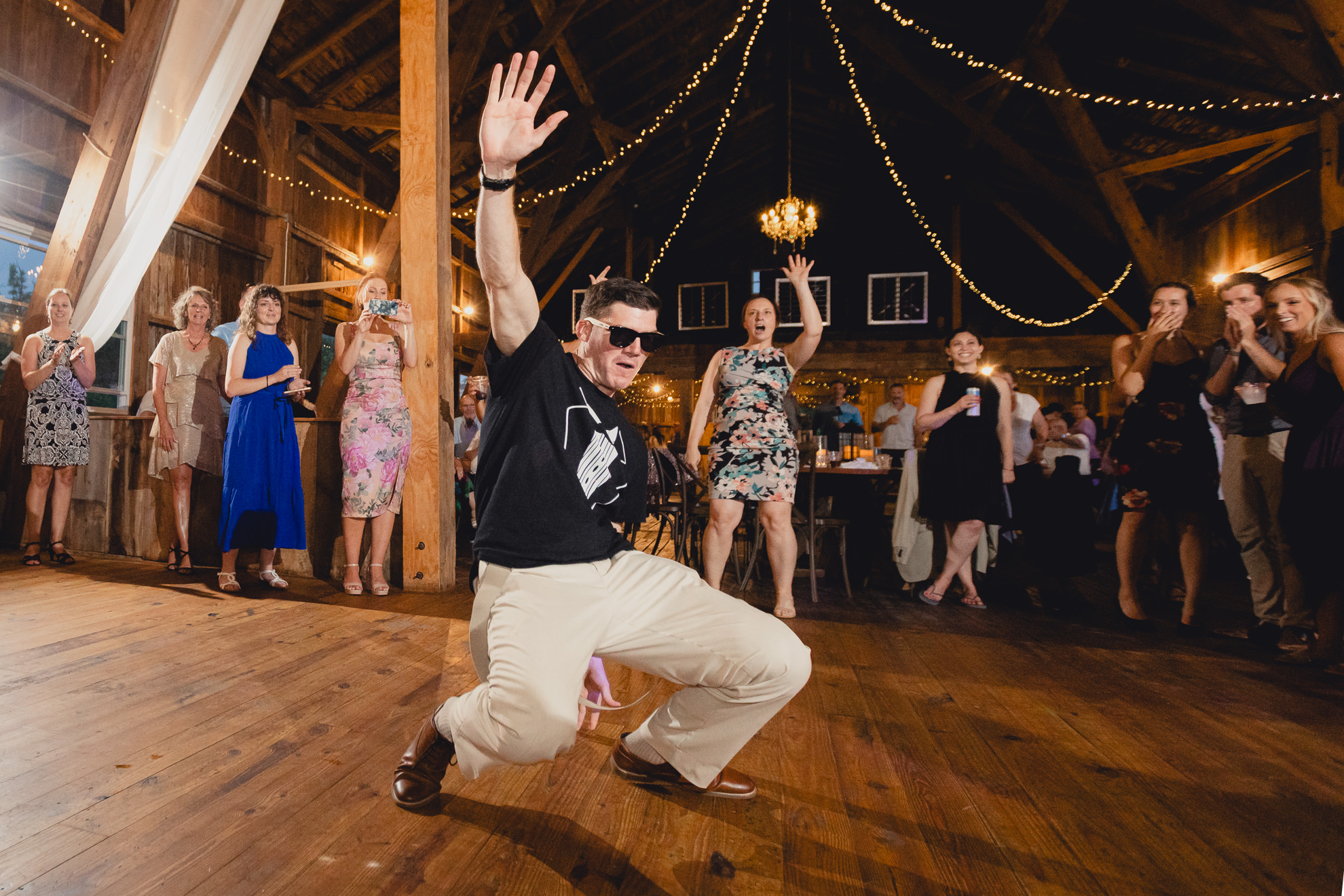 guests dance during wedding reception at The Gallagher Barn in Medina, NY