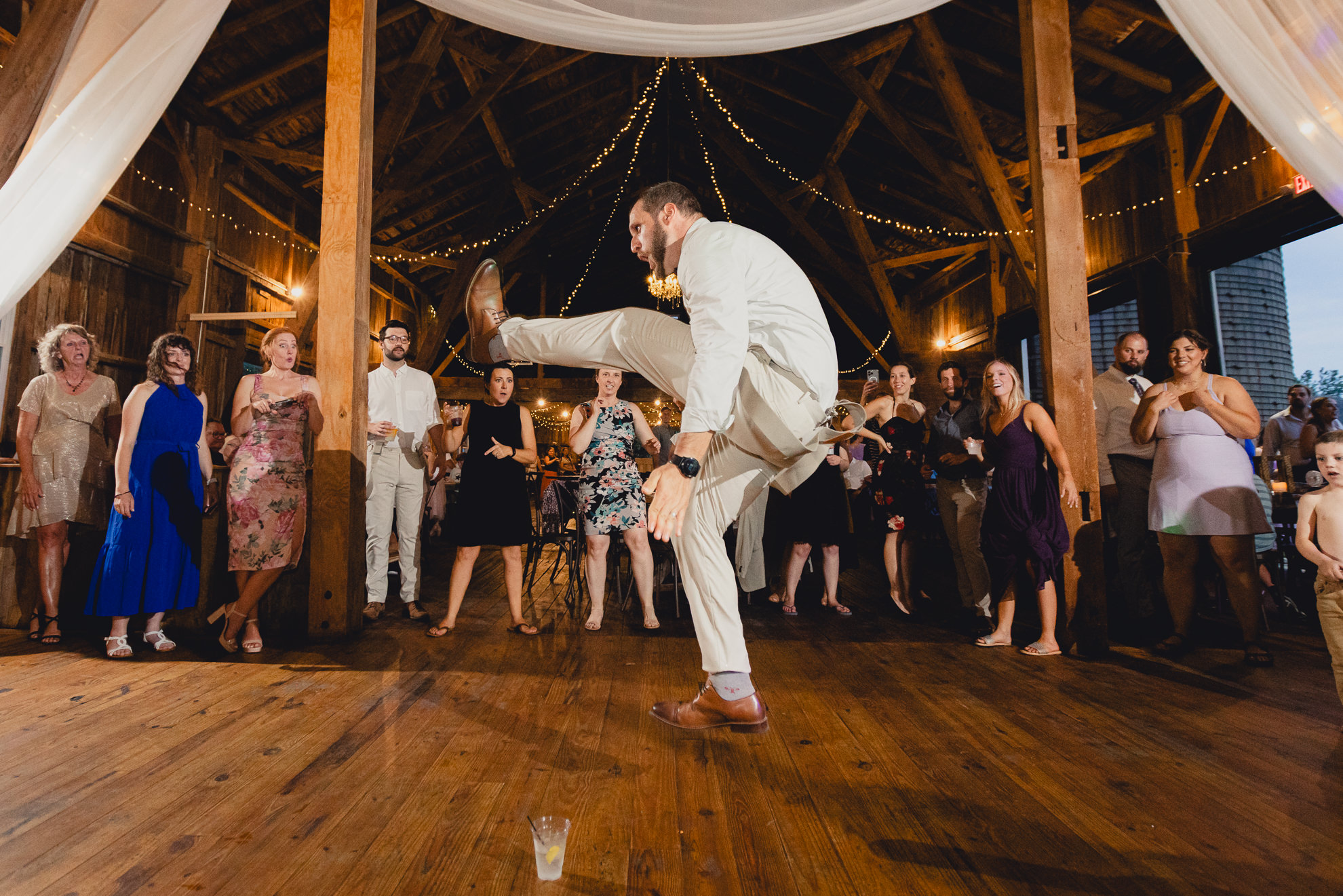 guests dance during wedding reception at The Gallagher Barn in Medina, NY