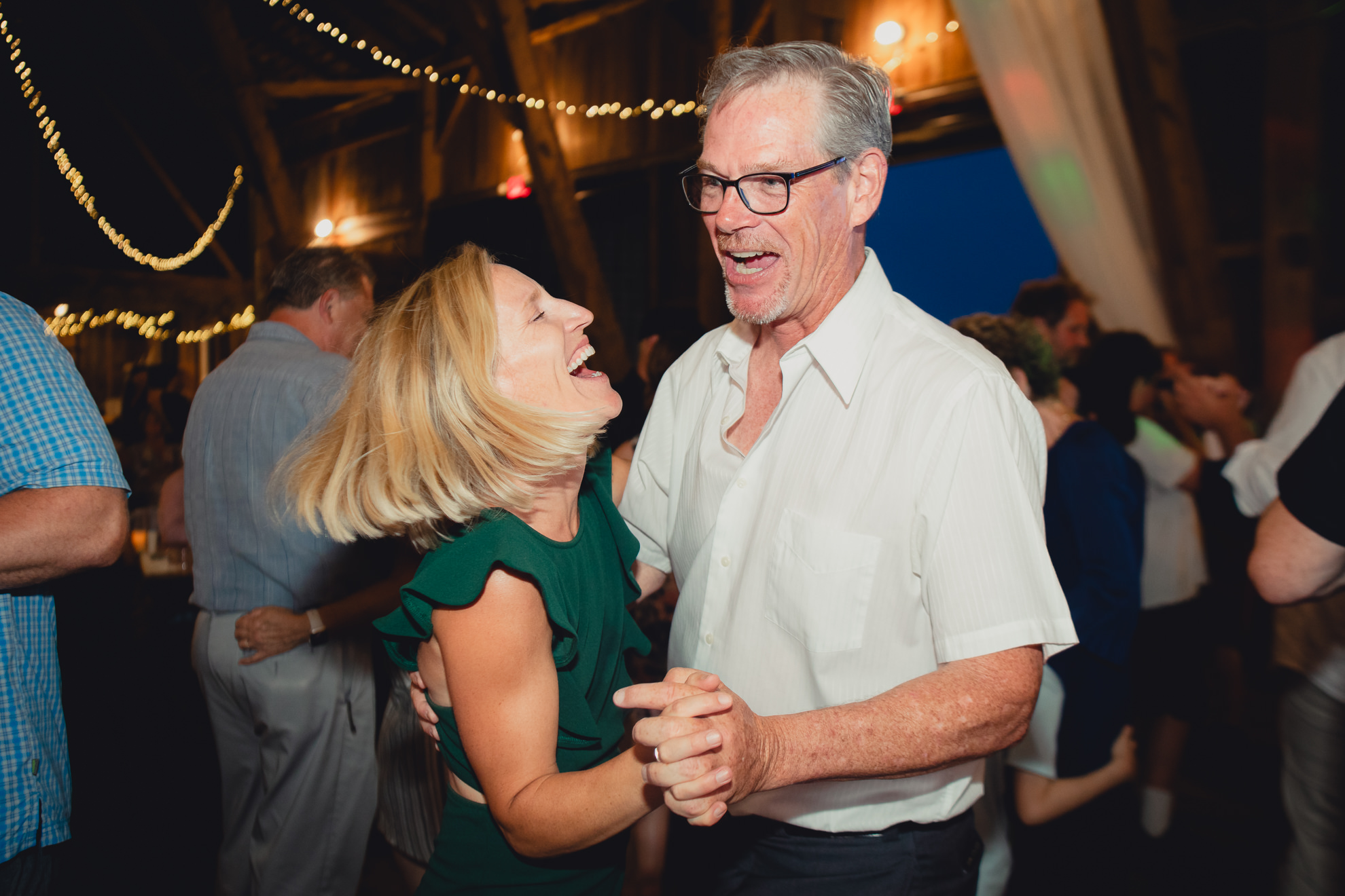 guests dance during wedding reception at The Gallagher Barn in Medina, NY