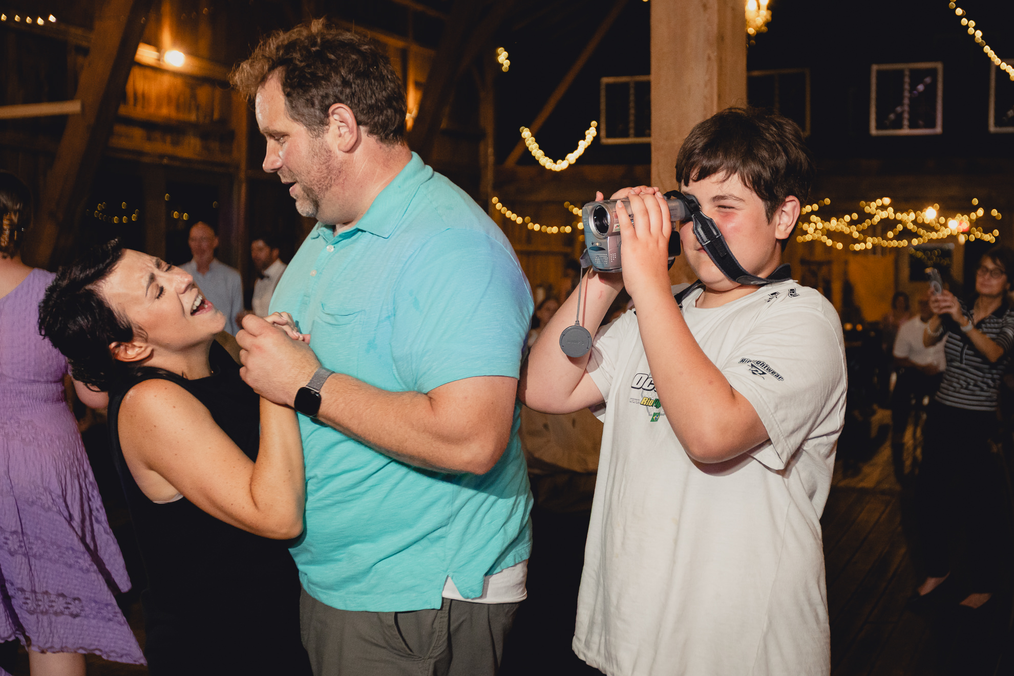 guests dance during wedding reception at The Gallagher Barn in Medina, NY