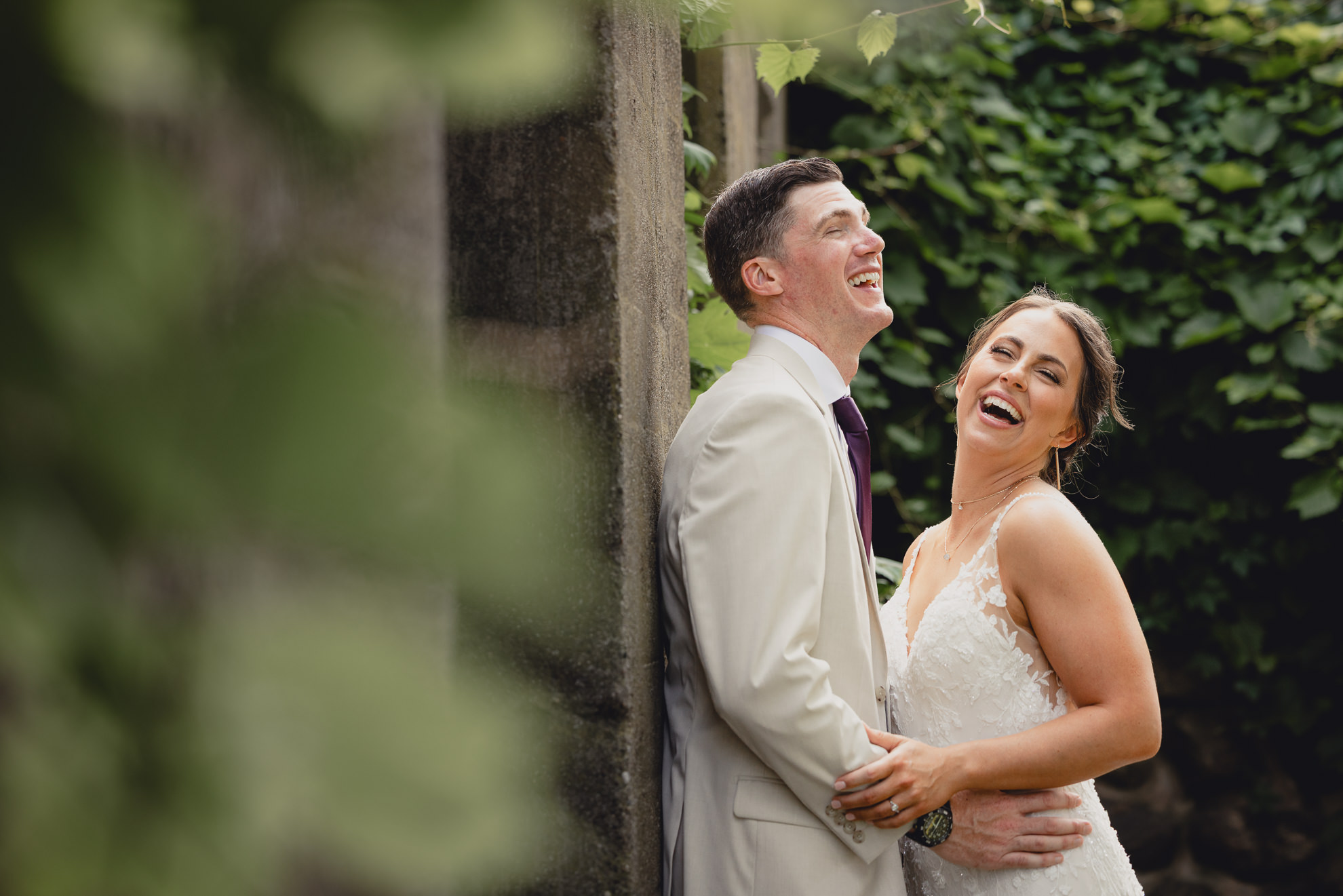 bride and groom pose for wedding photography portrait outside The Gallagher Barn in Medina, NY