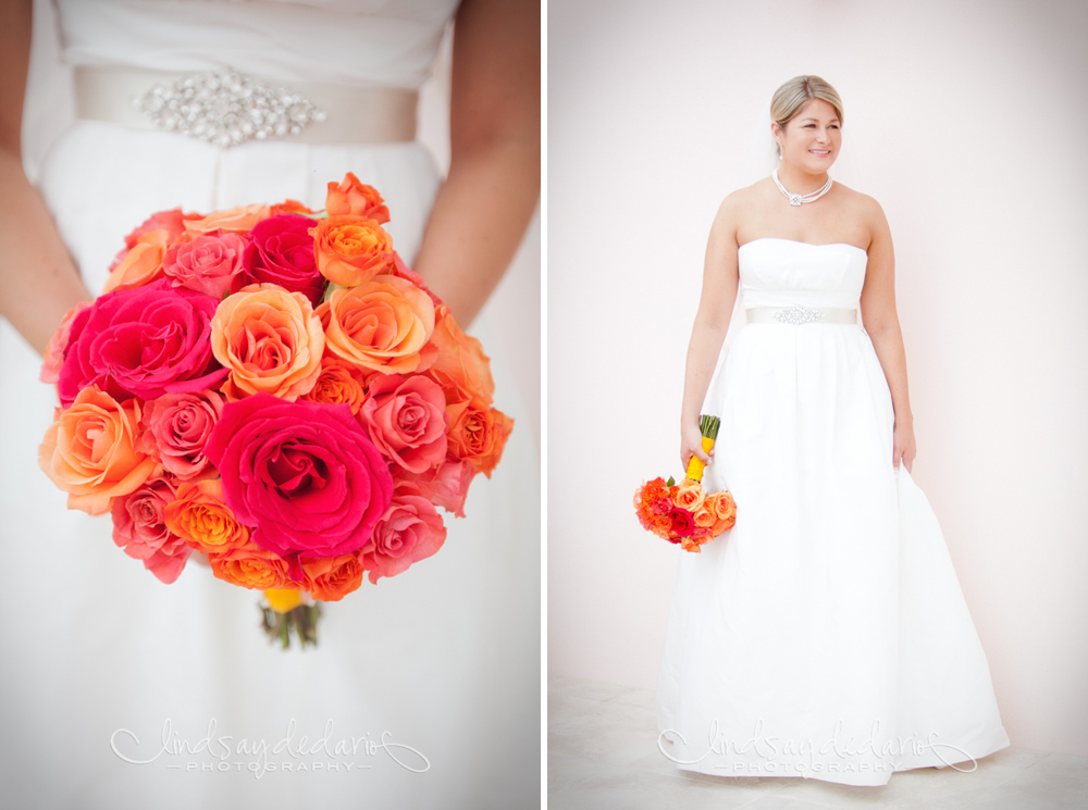 bride poses for portrait with colorful coral inspired flowers before destination wedding on Gasparilla Island Boca Grande, FL