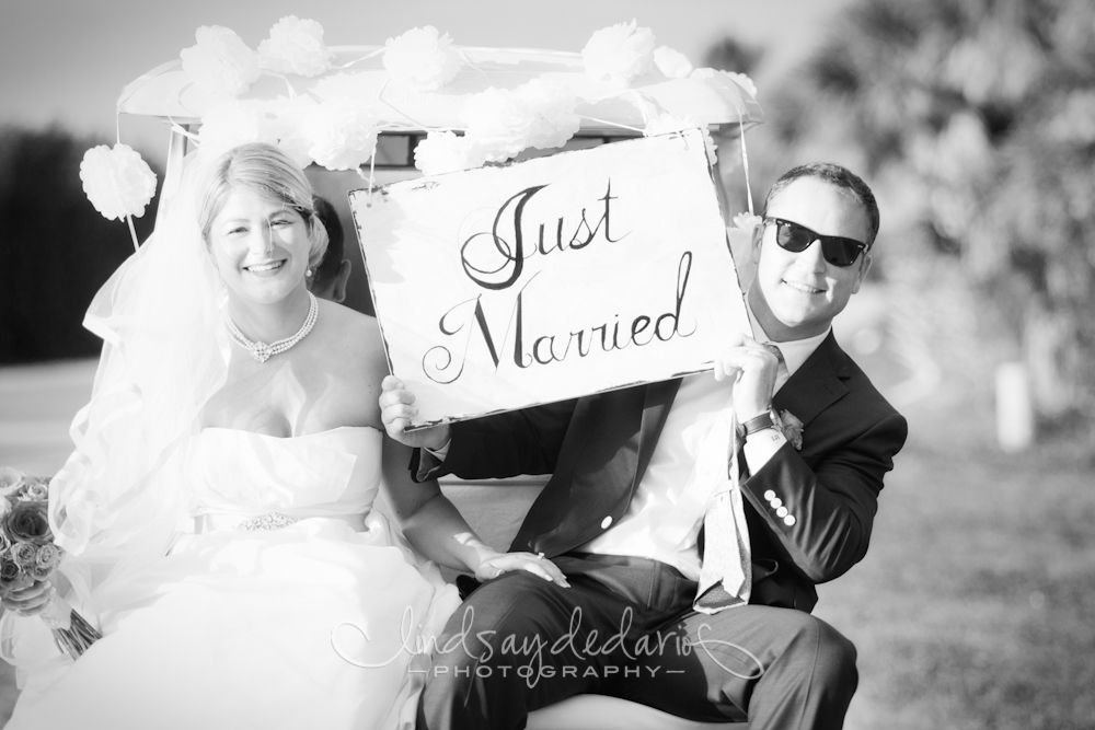 bride and groom exiting church on golf cart after destination wedding ceremony on Gasparilla Island Boca Grande, FL