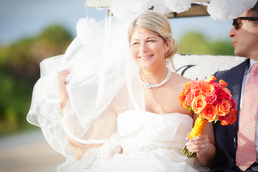 bride and groom exiting church on golf cart after destination wedding ceremony on Gasparilla Island Boca Grande, FL