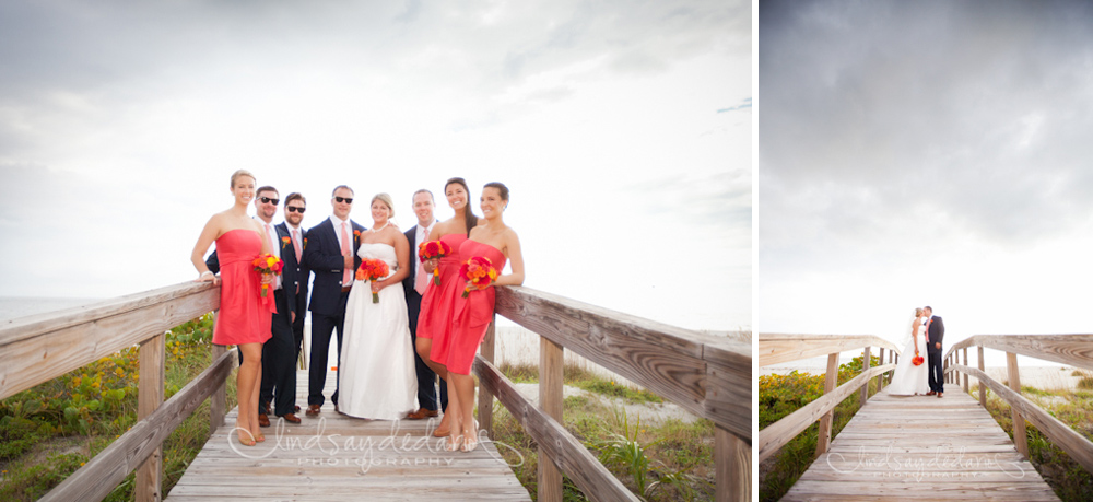 wedding party smiles for photographer on boardwalk at beach after destination wedding ceremony on Gasparilla Island Boca Grande, FL