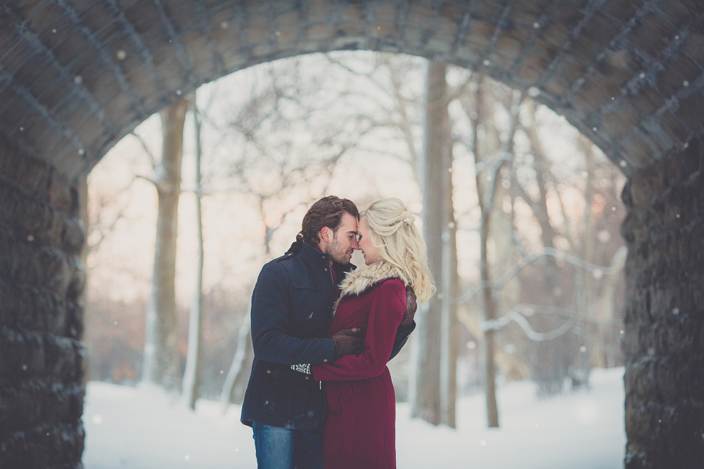 weddwedding engagement photography of couple under Ivy Bridge at Delaware Park in Buffalo, NYing engagement photography of couple at Delaware Park in Buffalo, NY