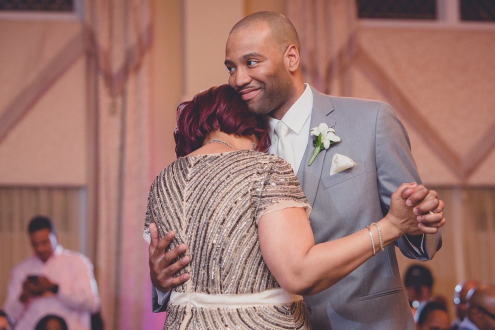 groom dances with mother at ballroom wedding reception at the Avanti Mansion in WNY 