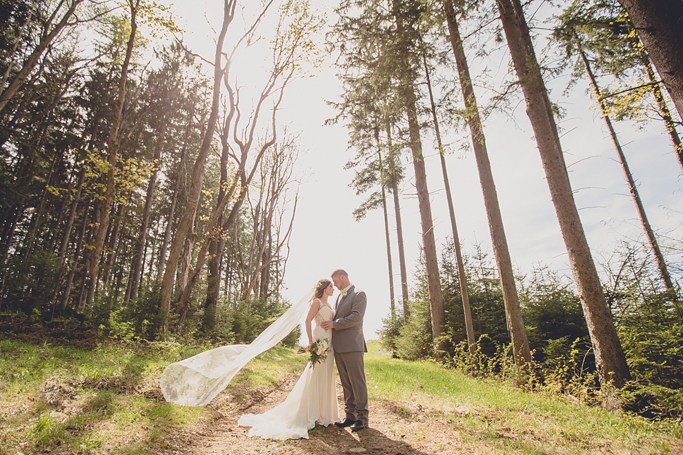 bride and groom pose for portrait at ski lodge wedding at holiday valley in ellicottville, ny