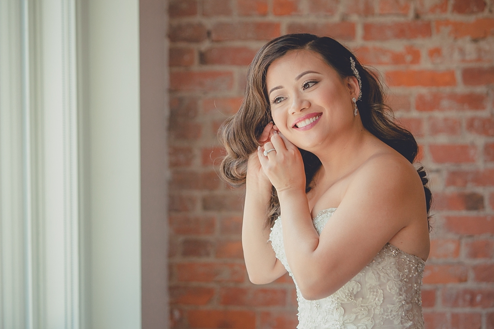 bride prepares for wedding in hotel room at Webb Lofts on Pearl St. in Buffalo, NY