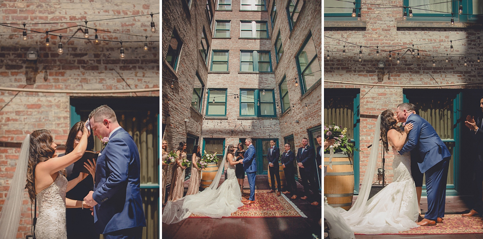 couple stands in courtyard during ceremony at whimsical urban woodland themed wedding in buffalo, ny at webb lofts, lafayette hotel, pearl st brewery