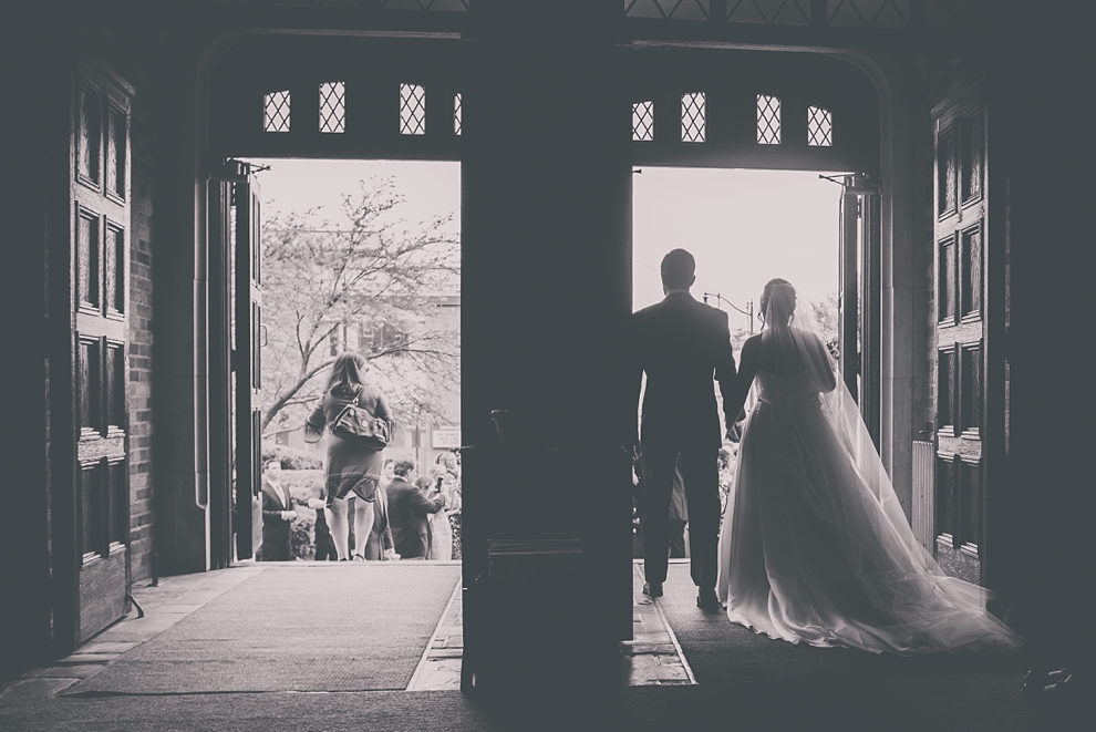 bride and groom exit church during wedding at St. Joseph's University Parish Church in Buffalo, NY