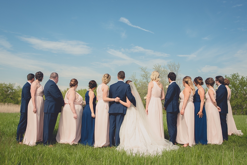 bridal party poses for portrait at Tifft Nature preserve during wedding in Buffalo, NY