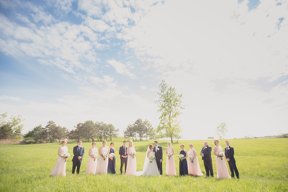 bridal party poses for portrait at Tifft Nature preserve during wedding in Buffalo, NY