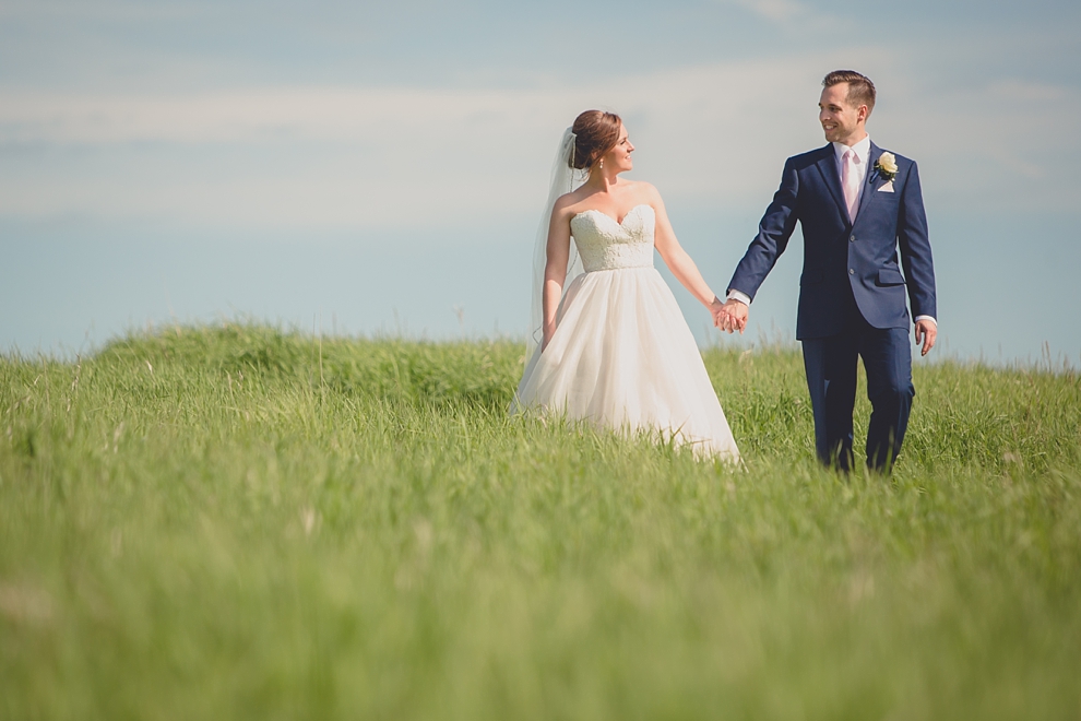 bride and groom embrace at tifft nature preserve during their wedding in Buffalo, NY