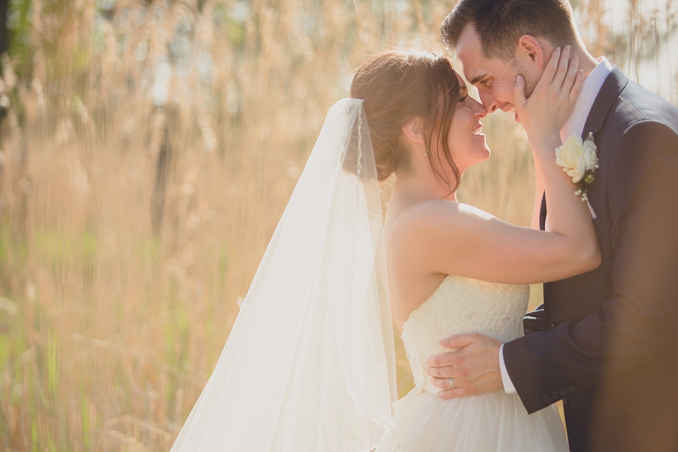 bride and groom embrace at tifft nature preserve during their wedding in Buffalo, NY