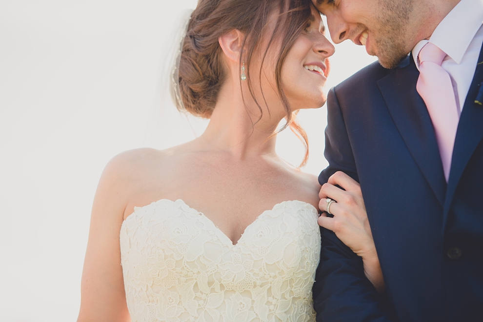 bride and groom embrace at tifft nature preserve during their wedding in Buffalo, NY