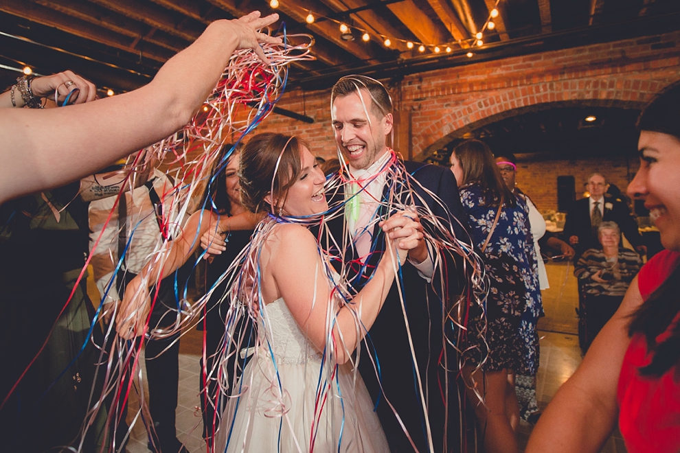bride and groom dance with ribbon wrapped around them at wedding at Pearl Street Grill and Brewery in Buffalo, NY