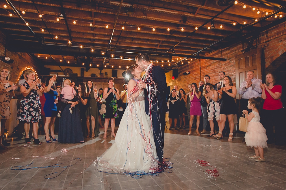 bride and groom dance with ribbon wrapped around them at wedding at Pearl Street Grill and Brewery in Buffalo, NY