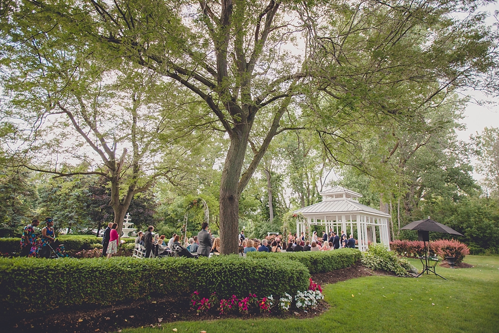 wide angle photo during garden wedding ceremony at Samuel's Grande Manor near Buffalo, NY