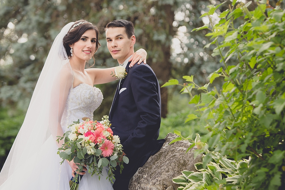 bride and groom pose for portraits after garden wedding ceremony at Samuel's Grande Manor near Buffalo, NY