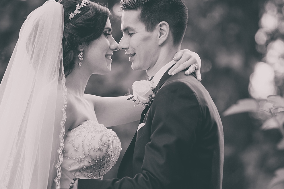 bride and groom pose for portraits after garden wedding ceremony at Samuel's Grande Manor near Buffalo, NY