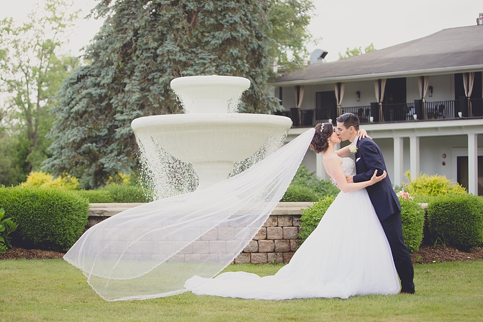 bride and groom pose for portraits after garden wedding ceremony at Samuel's Grande Manor near Buffalo, NY