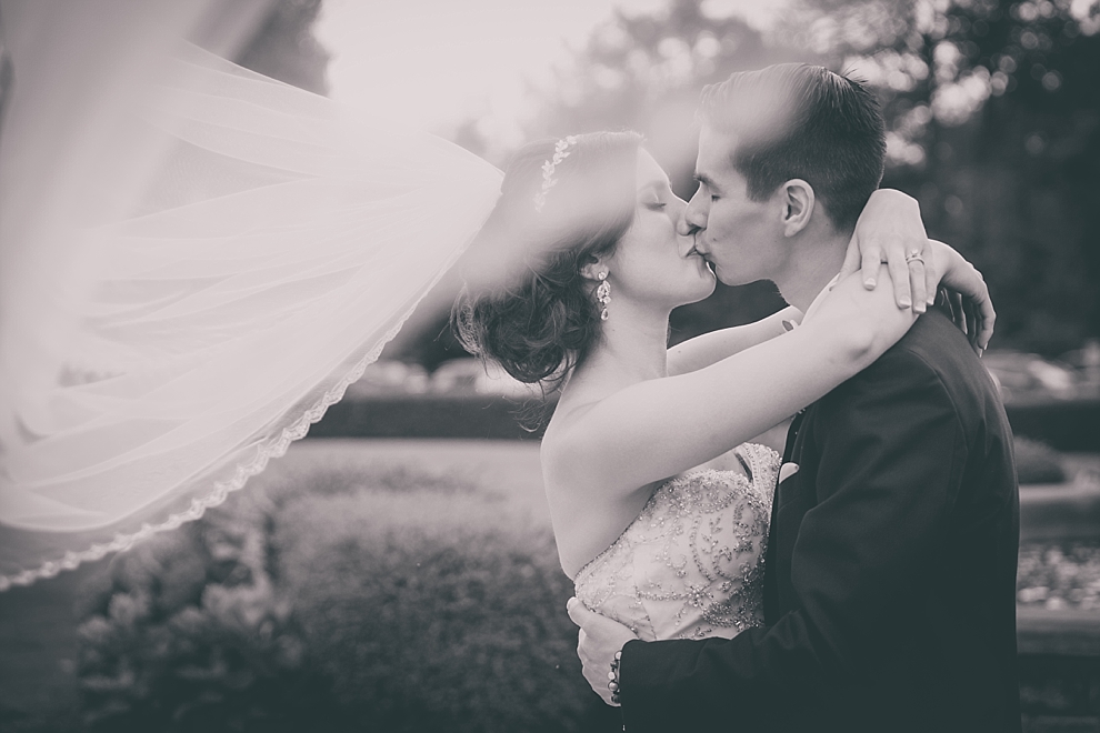bride and groom pose for portraits after garden wedding ceremony at Samuel's Grande Manor near Buffalo, NY