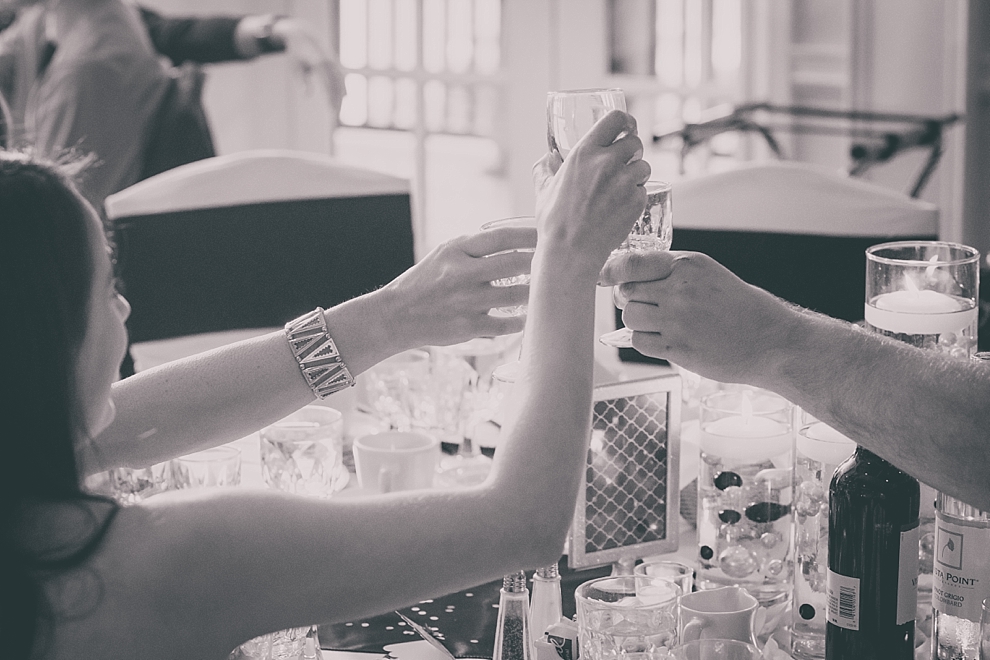guests cheers after toast during wedding reception at Samuel's Grande Manor near Buffalo, NY