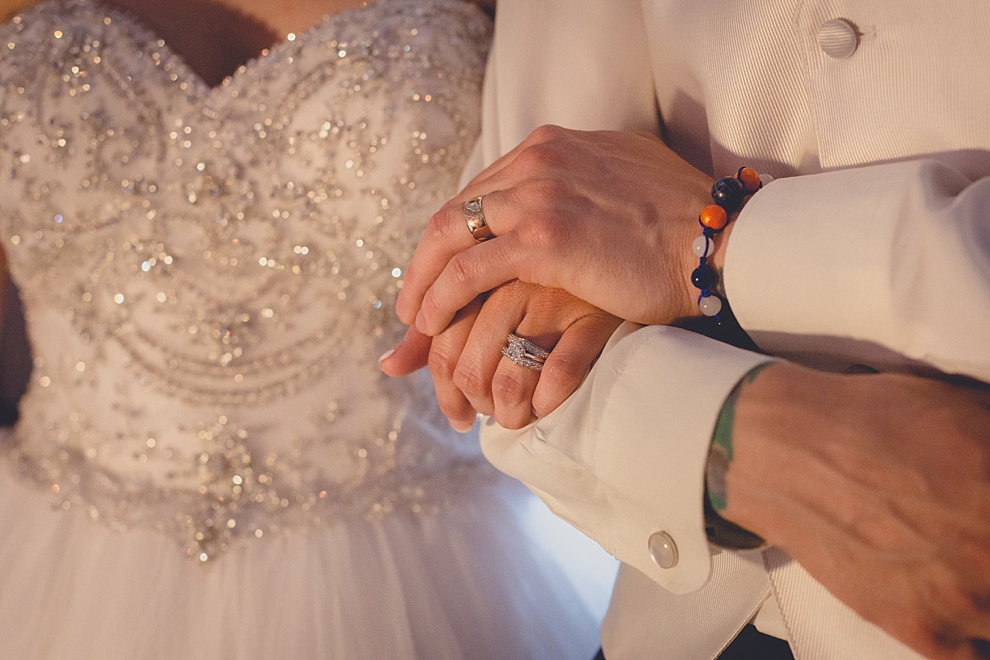 bride and grooms rings during wedding reception at Samuel's Grande Manor near Buffalo, NY