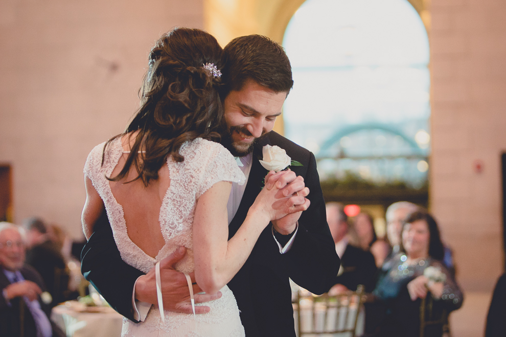 bride and groom dance during speech at ballroom wedding reception venue, the Admiral Room, in Buffalo, NY