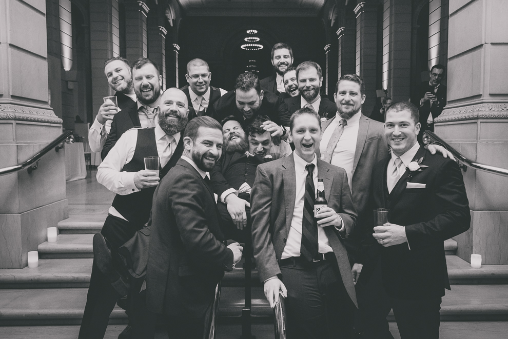 friends pose for picture at ballroom wedding reception venue, the Admiral Room, in Buffalo, NY