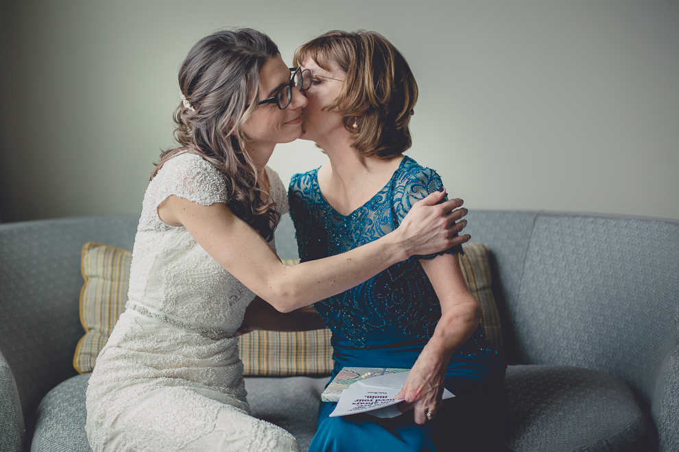 bride and mom hug after giving gifts before wedding at Marriott Hotel in Buffalo, NY