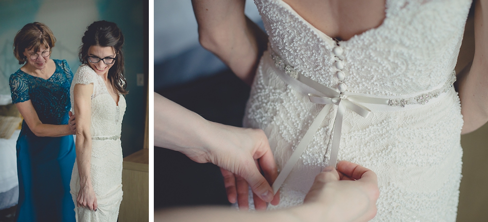 mother ties dress ribbon for bride as she gets ready for wedding at Marriott Hotel in Buffalo, NY