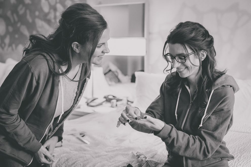 bride receives gift from groom before wedding at Marriott Hotel in Buffalo, NY