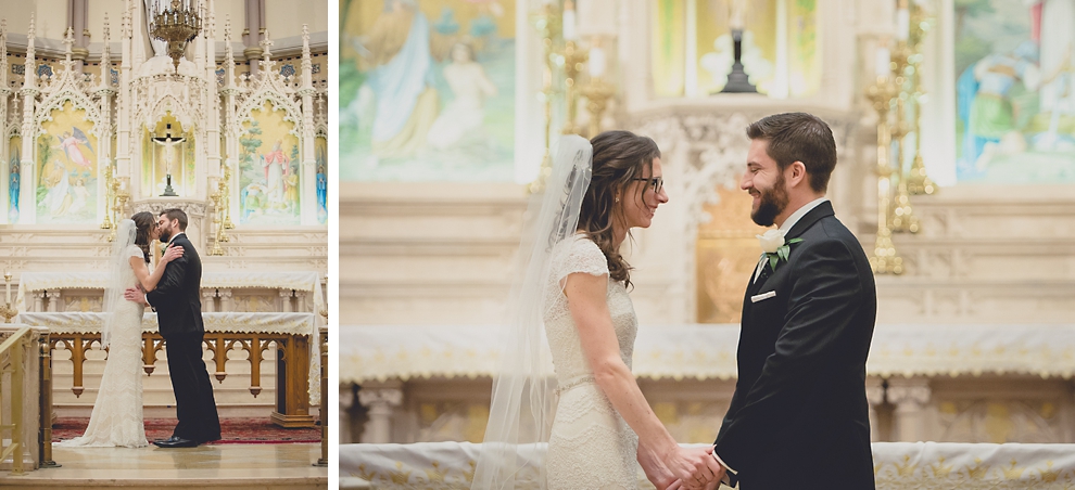 bride and groom share first kiss during wedding ceremony at St. Louis Church in Buffalo, NY