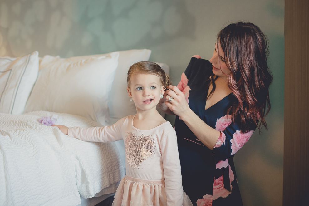 flower girl gets hair done before wedding at Marriott Hotel in Buffalo, NY