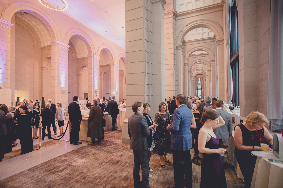 guests enjoy cocktail hour during ballroom wedding reception venue, the Admiral Room, in Buffalo, NY