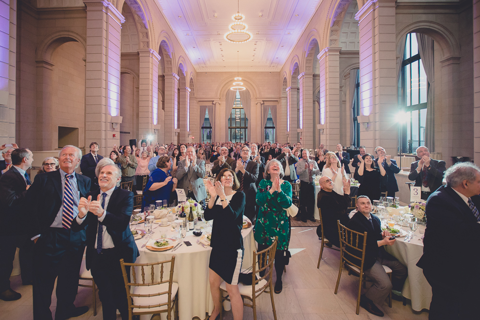 guests clap for bride and groom at ballroom wedding reception venue, the Admiral Room, in Buffalo, NY