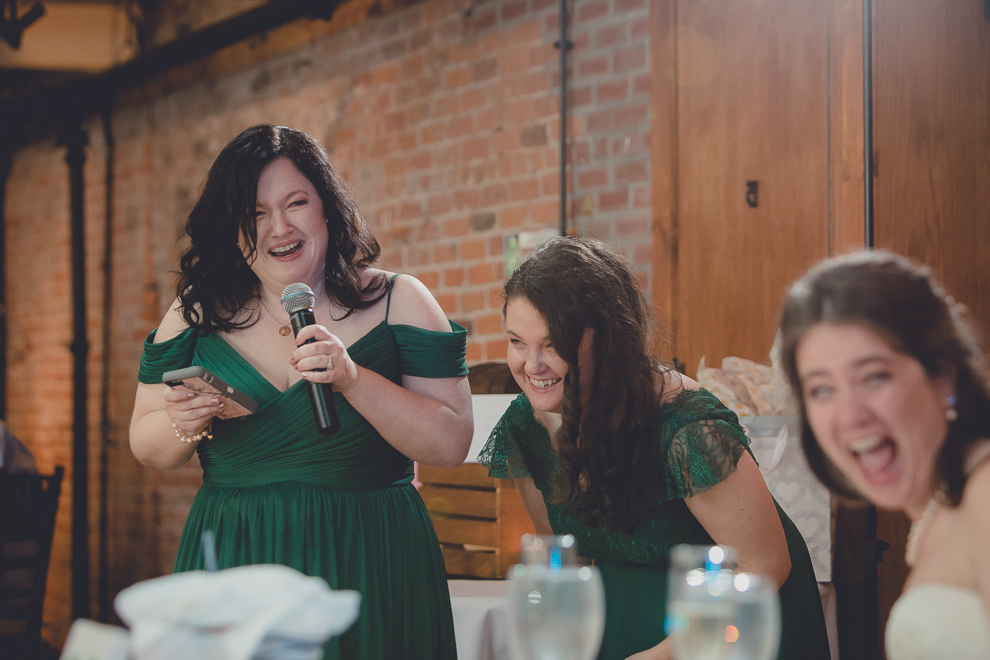 maid of honor laughs while delivering speech during wedding reception in Hotel Lafayette in Buffalo, NY