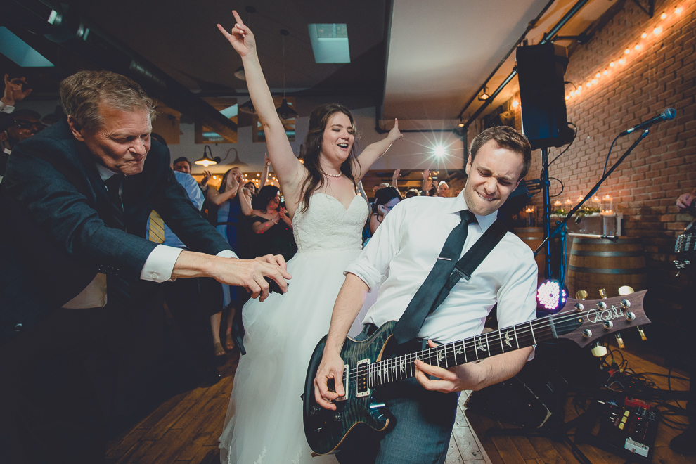groom plays with James Blonde Band during wedding reception in Hotel Lafayette in Buffalo, NY