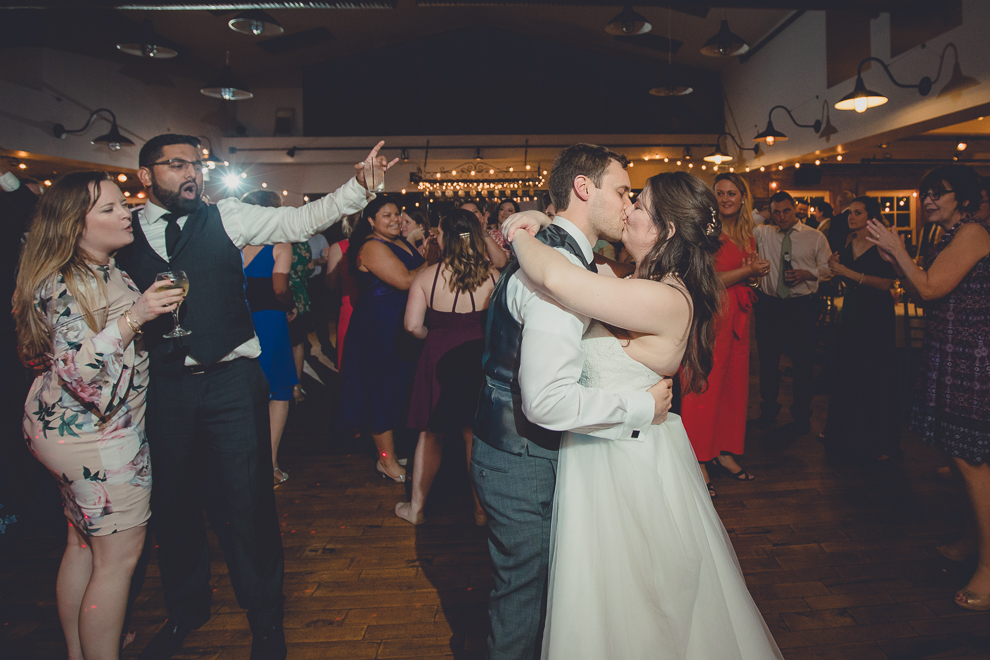 bride and groom kiss while dancing during wedding reception in Hotel Lafayette in Buffalo, NY