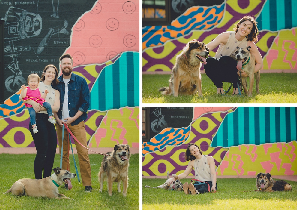 Family poses with dogs during family portrait photography session in front of murals on Chandler St. in Buffalo, NY
