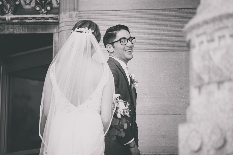bride and groom have reveal or first look at City Hall before their Avanti Mansion wedding in Buffalo, NY