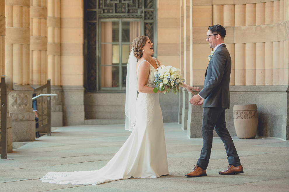 bride and groom have reveal or first look at City Hall before their Avanti Mansion wedding in Buffalo, NY