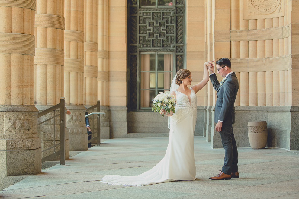 bride and groom have reveal or first look at City Hall before their Avanti Mansion wedding in Buffalo, NY